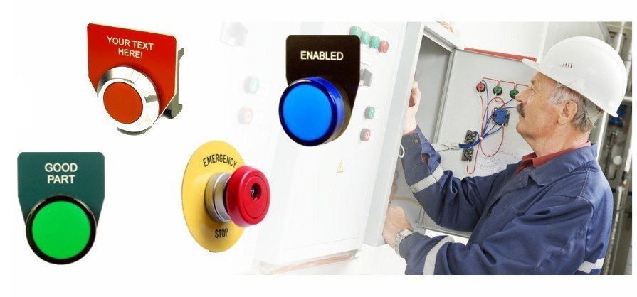 Electrician at a control panel with custom engraved legend plates for push buttons, pilot lights and e-stops
